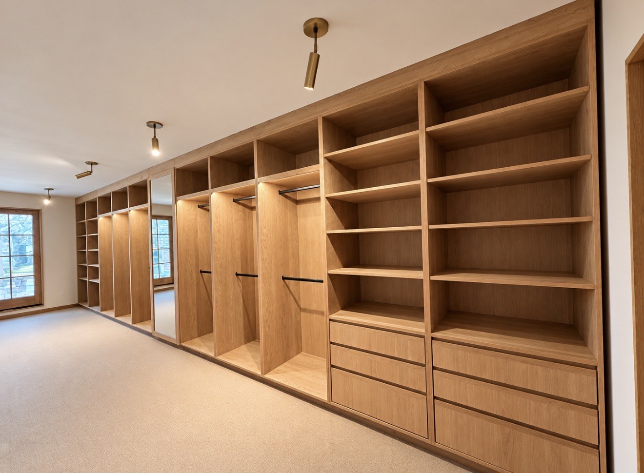 Wood wardrobe cabinetry with open shelves and hanging storage